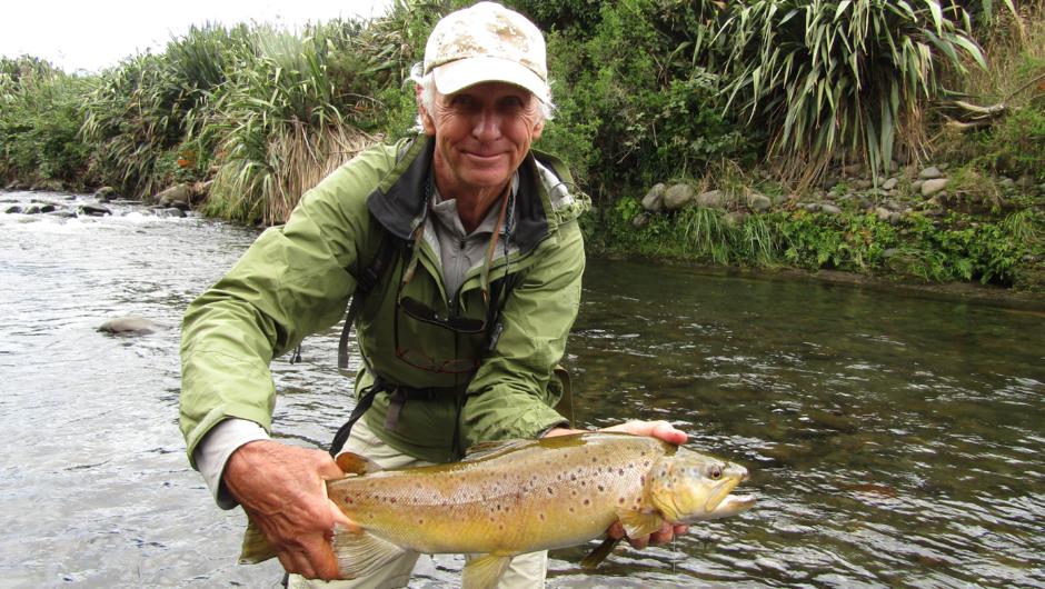5lb plus Taranaki brown trout displayed by happy angler