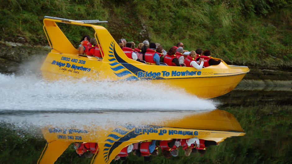 One of our Bridge to Nowhere jet boats with a group of happy clients.