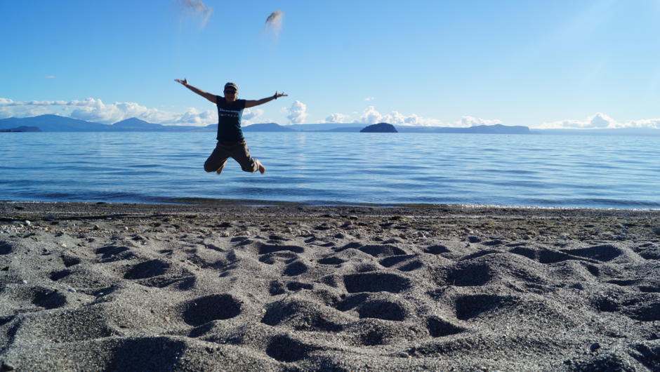 Jumping for joy on the shores of Lake Taupo