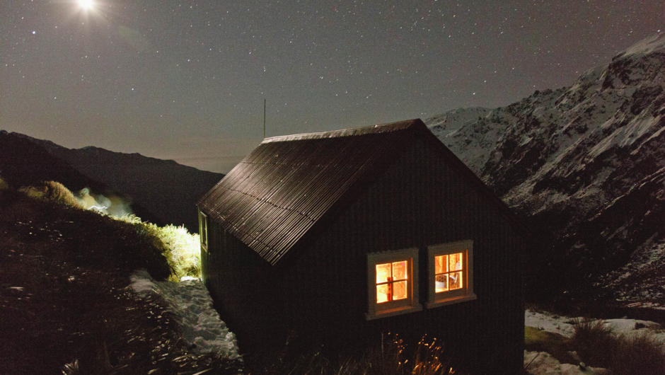 On a clear evening, enjoy the mountains to sea vista and crystal clear air while inside the historic hut is bathed in candlelight.