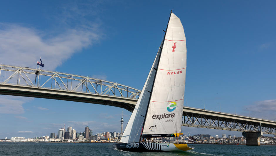 America&#039;s Cup Yacht sailing under the Auckland Harbour Bridge