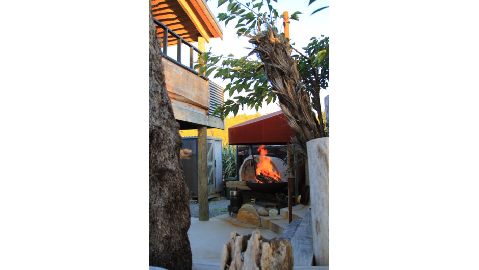 2nd Level Lodge building with outdoor bar & lower level Courtyard with Fire-pit
