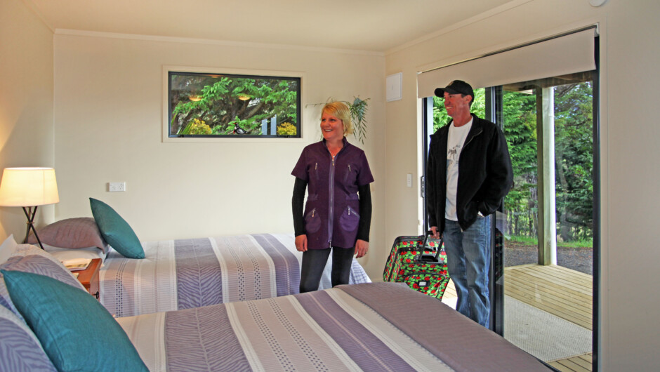 Tui cottage, furnished with double and king single beds. Great for twin share or small families.
