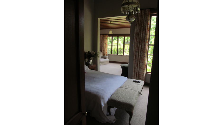 Queen bedroom with private lounge overlooking garden