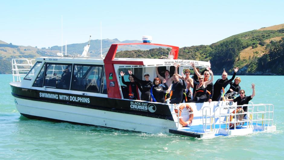 Happy Customers heading out to swim with dolphins in Akaroa