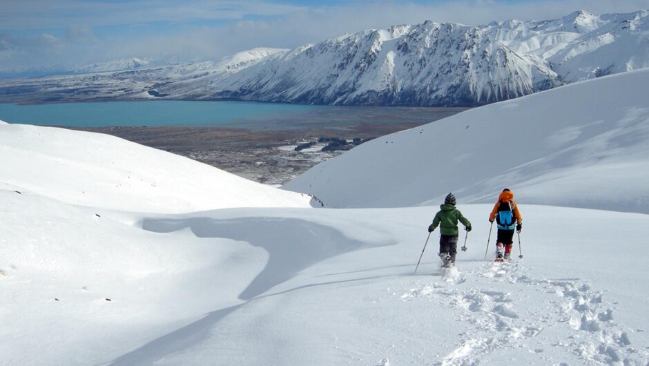 Snowshoeing high above Lake Tekapo in the foothills of the Southern Alps.