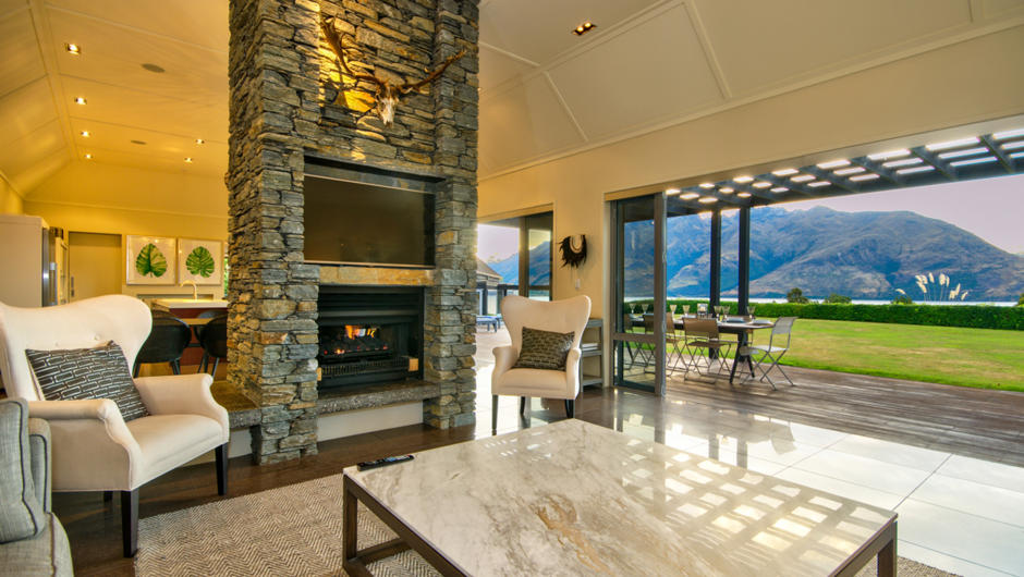 Lounge area with feature fire and views
