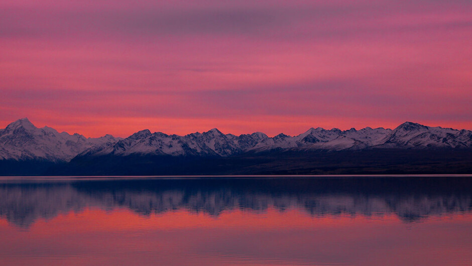 LAke Pukaki at dusk with Aoraki Mt Cook reflected in the calm evening waters