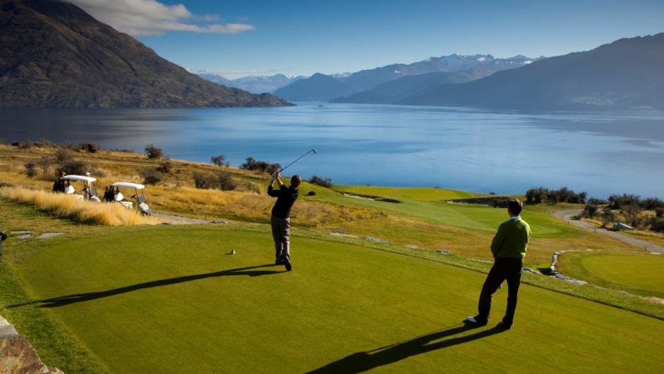 Golfers tee off at Jack's Point Golf Course, Queenstown, New Zealand