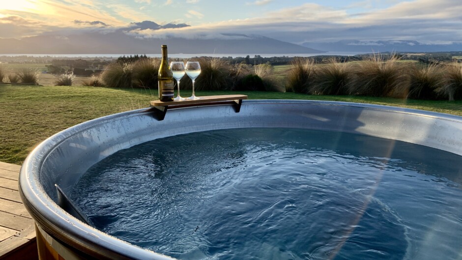 ★This is New Zealand★ 
Does it get any better than this? NZ-made hot tub, NZ-made wine, stunning NZ landscapes... 
Enjoy the luxury of soaking in Fiordland Eco-Retreat's new hot tub (spa pool) after a long day exploring Fiordland.