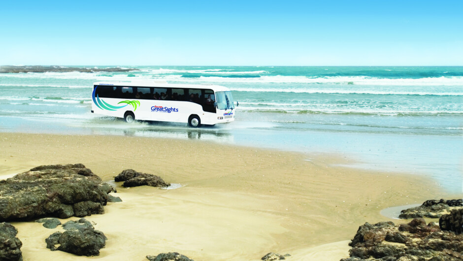 Tourist bus driving the beach Highway near Cape Reinga.
