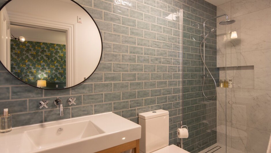 A typical ensuite with floor to ceiling tiling. This is Room 4.