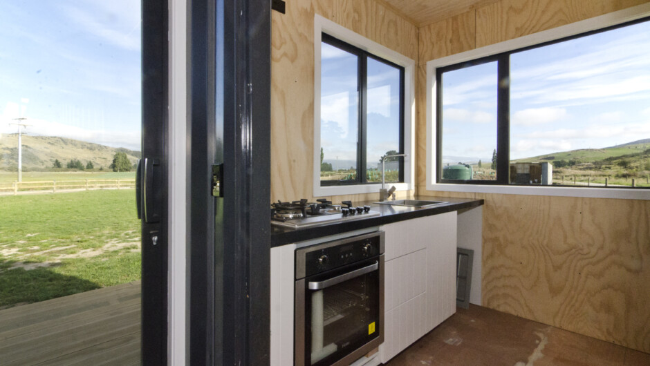 Small but perfect kitchen in Container house in Millers Flat - Voyager Cabins.