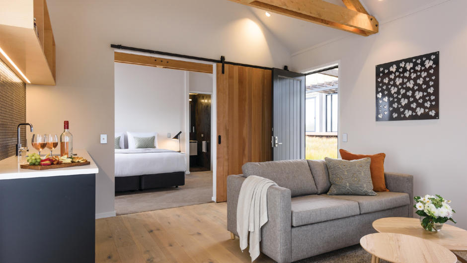 Our Tui suite. 5 luxurious single bedroom villas (circa 40m2) with a king size bed or option for single beds. A fully-equipped en-suite bathroom with heated floors, towel rails and mirrors also features. Guests enjoy their own separate lounge/dining area 