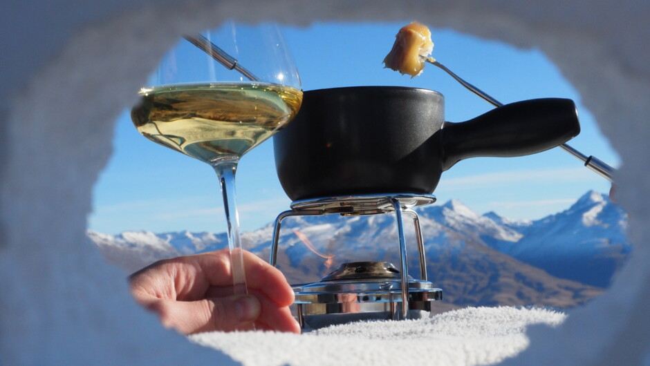 Enjoy a fondue on a mountain top overlooking the Southern Alps.