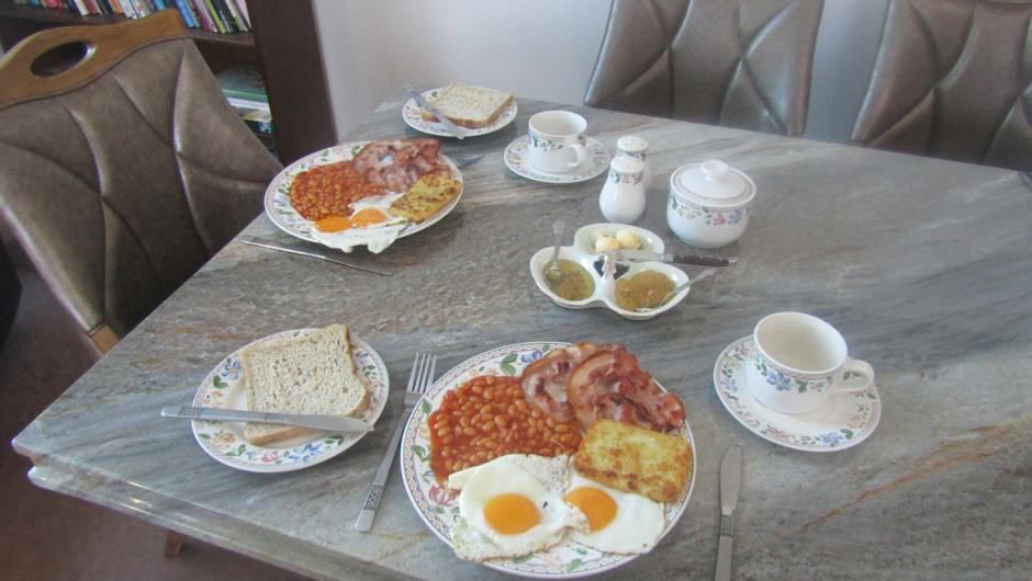 A hearty hot breakfast. Great hot breakfast to start the day bacon, eggs, hash brown with toast and coffee/ tea