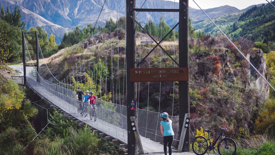 Follow the river crossing suspension bridges