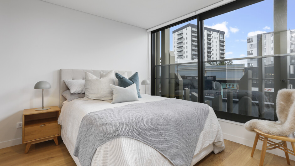 Stylish Master bedroom includes large doors to let in fresh air, and an ensuite.