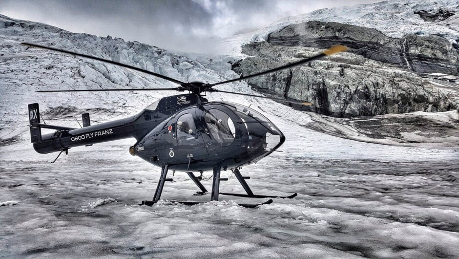 Our MD520N helicopter at the Shackleton Glacier bowl after a summer rain.