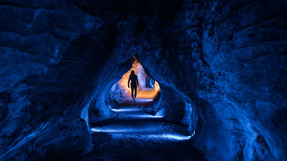 Discover glowworms and cave formations deep underground.