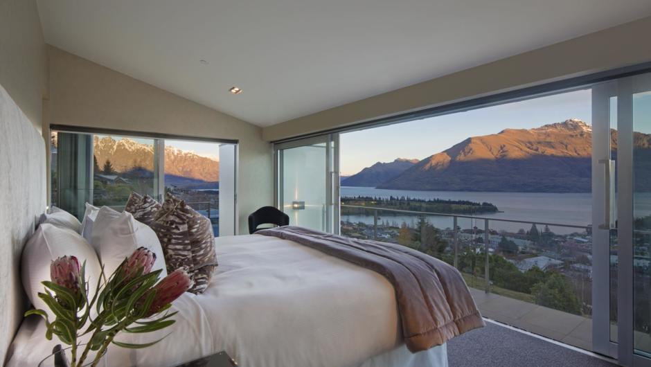 A truly spectacular master bedroom overlooking town below and the many mountain peaks