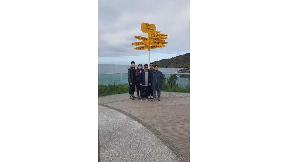 Tourist enjoying Bluff's world famous Stirling Point