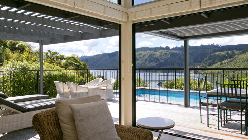The Point Villas - floor to ceiling glass doors open to the pool