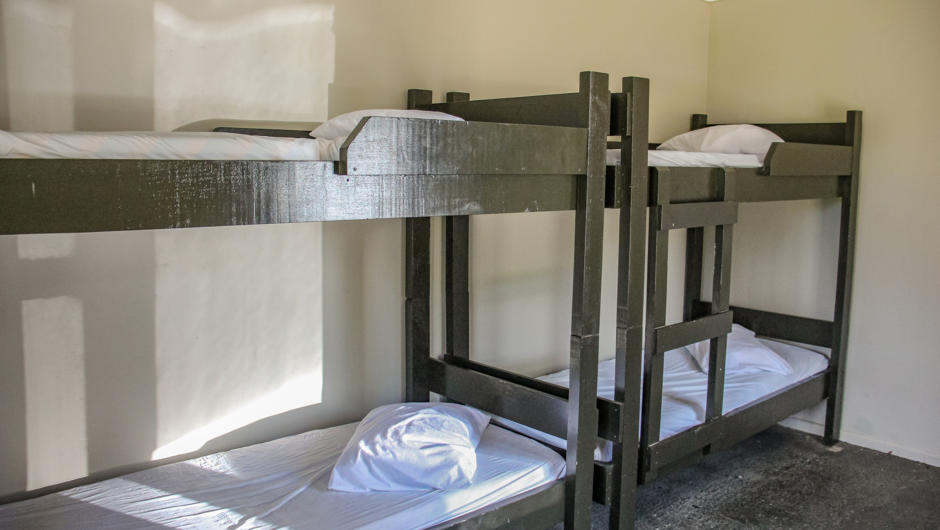 The Dormitory is partitioned into single and 4 berth bunks. Suitable for schools, camps, church groups and retreats.