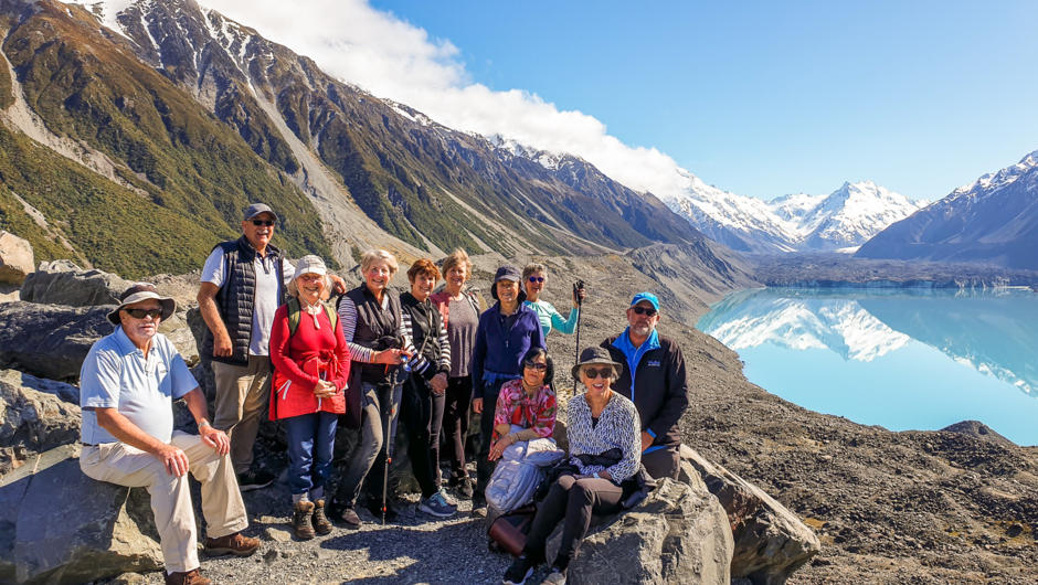 MoaTours guests and Kiwi Guide Tim at the Tasman Glacier lake in Aoraki Mt Cook National Park