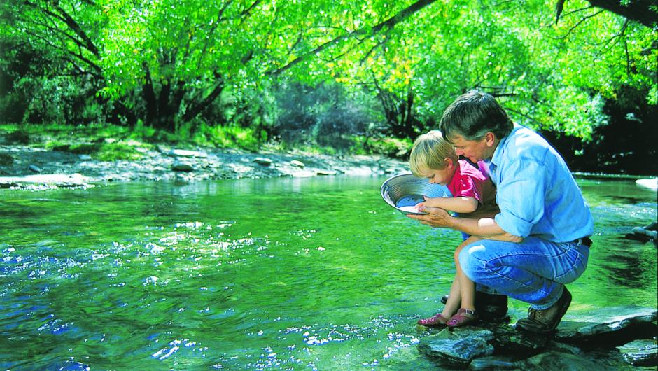 Gold panning in the Arrow River just 2 minutes from Arrowtown.