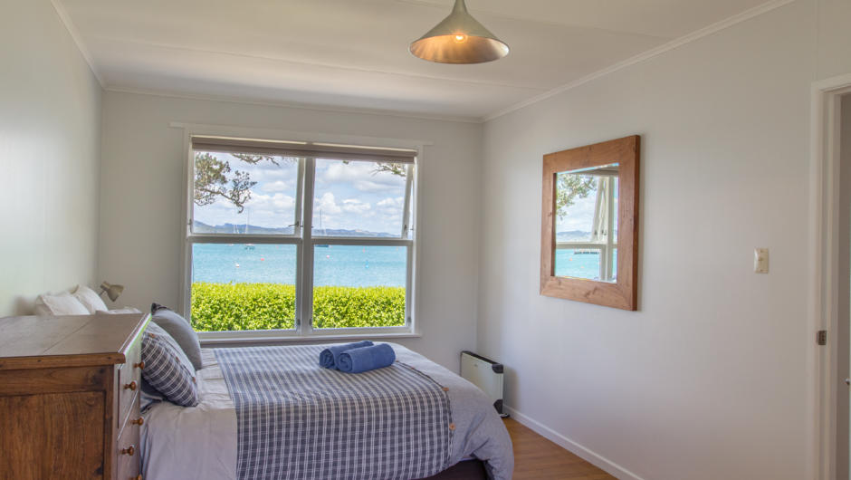 Master bedroom  (1 queen) with water views and ensuite bathroom