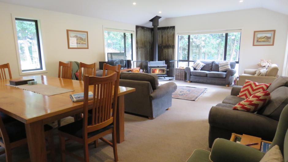 The spacious living area. The large dining table is ideal for seating bigger groups. The farmstay has had a regular clientele of smaller self drive tour groups  wishing to experience New Zealand&#039;s heartland.