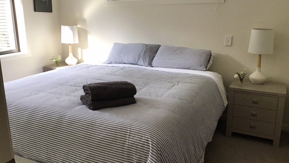 A bedroom view with a superking bed.  All the beds can be converted to 2 singles or a superking adding versatility for guests. A portacot is also available for younger children.