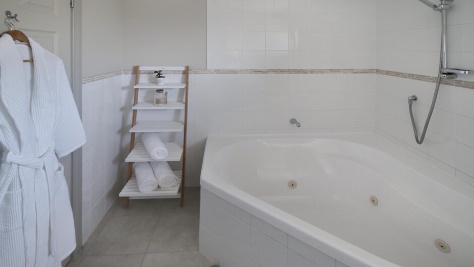 Spa bath studio, executive suite and family suite bathroom with luxurious 2 person spa bath