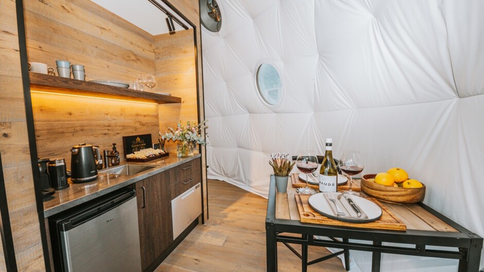 The kitchenette provides a perfect space to make a cup of tea or grab a glass of wine.