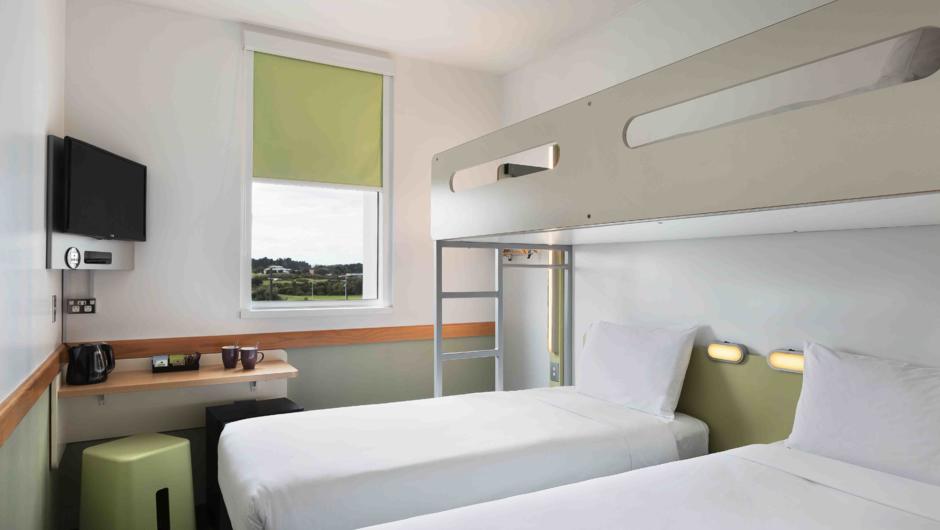 Standard room with 2 single beds and overhead bunk