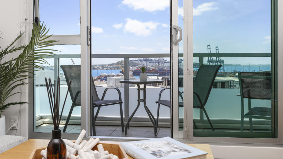 Detail shot looking through to lovely outdoor sitting arrangement to take in the harbour view.