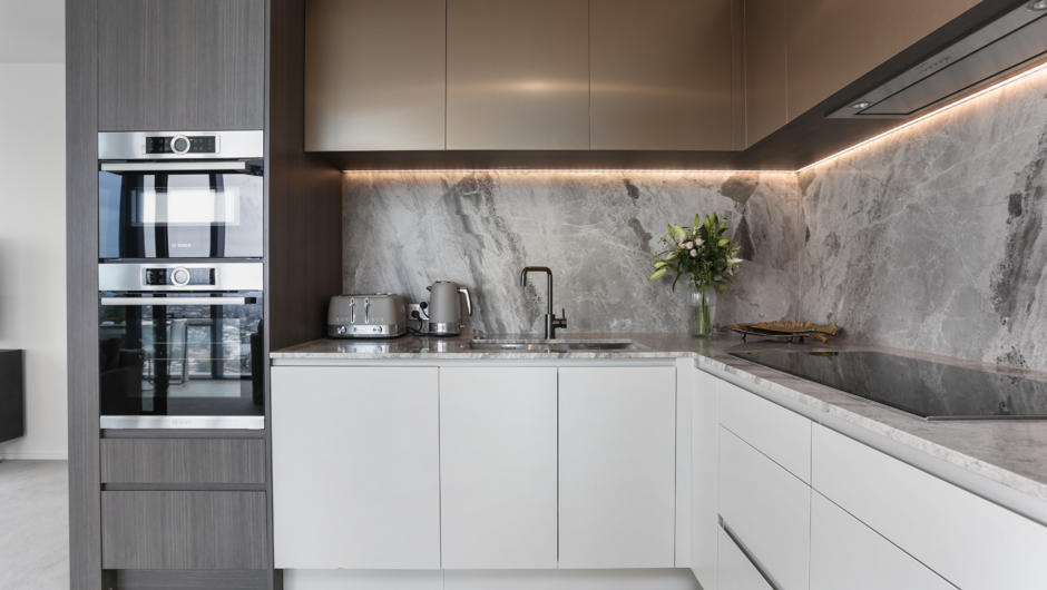 Exquisitely sleek marble details in the fully equipped kitchen.