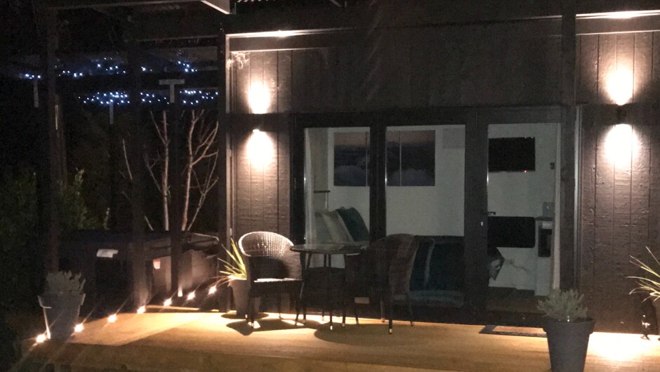 Night view of our Rua Awa cabin with private spa and canopy to the left.