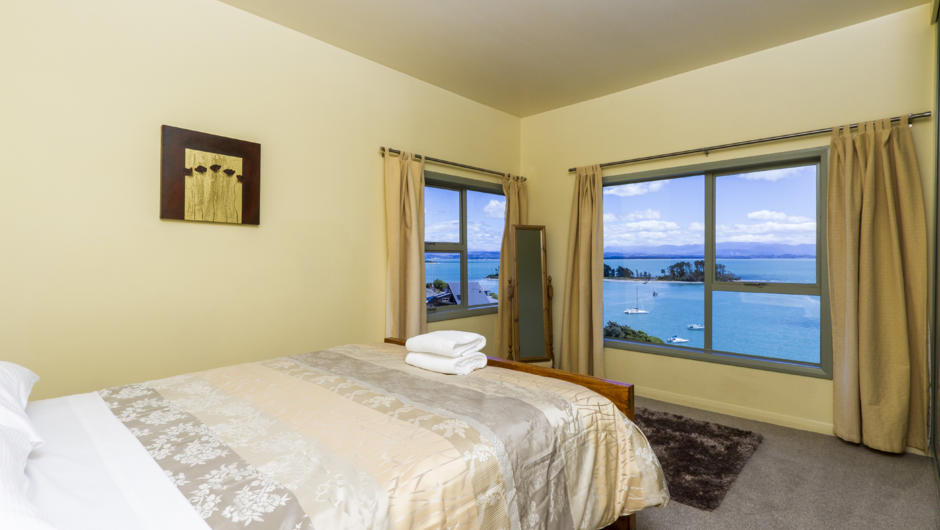 Bedroom 1 with queen bed &amp; sea views