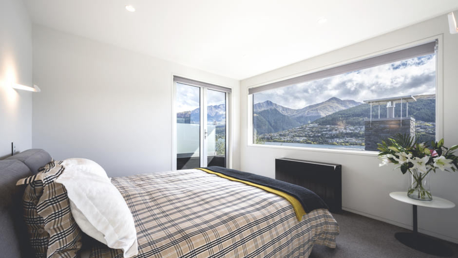 Bedroom one has expansive lake and mountain views as well as ensuite, dressing room and study