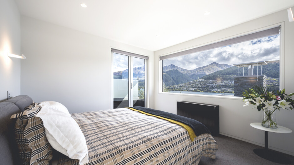 Bedroom one has expansive lake and mountain views as well as ensuite, dressing room and study