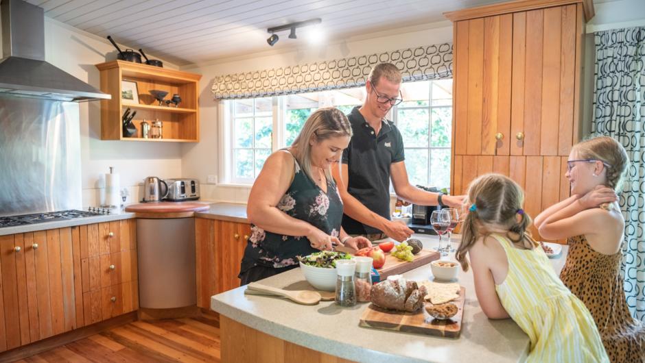 The Mt John Homestead includes a large kitchen and dining space for preparing and enjoying meals together.