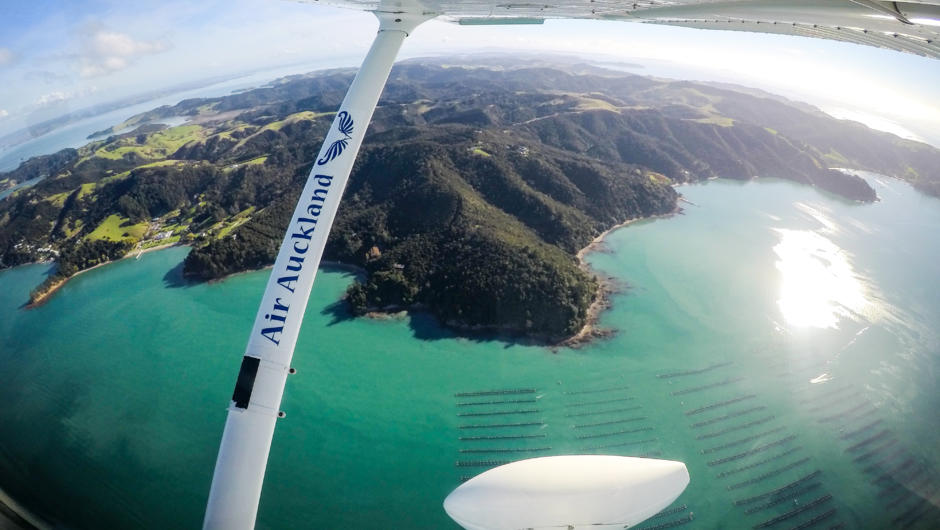 Air Auckland flying over Mussel Farm near the Coromandel Peninsula