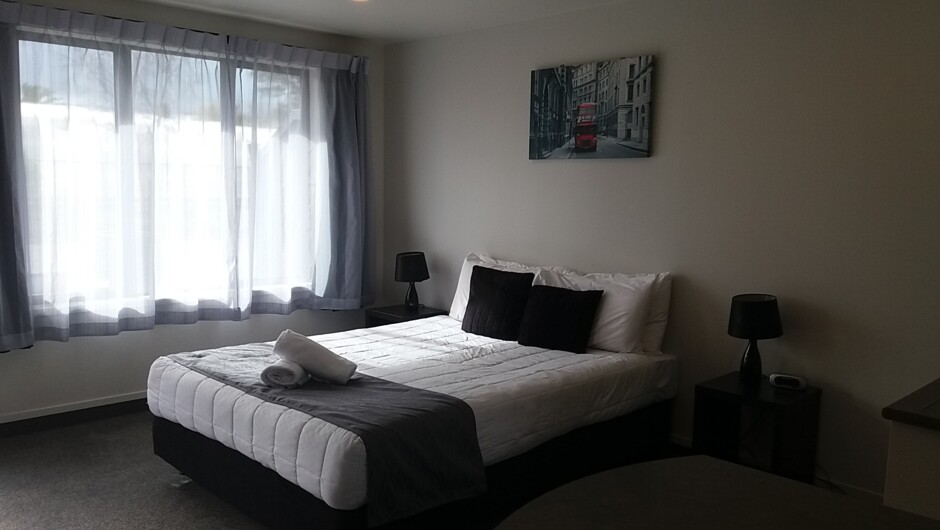 Motel style unit sleeps 2 with Queen bed in living area, bathroom, kitchen and sky tv.  Overlooks the pool area