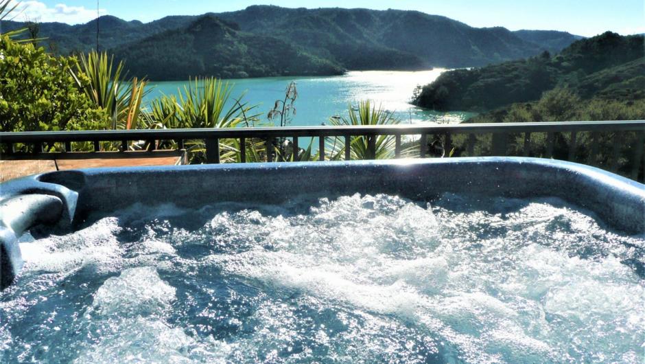 Enjoy the view of Whangaroa Harbour while relaxing in the spa tub.