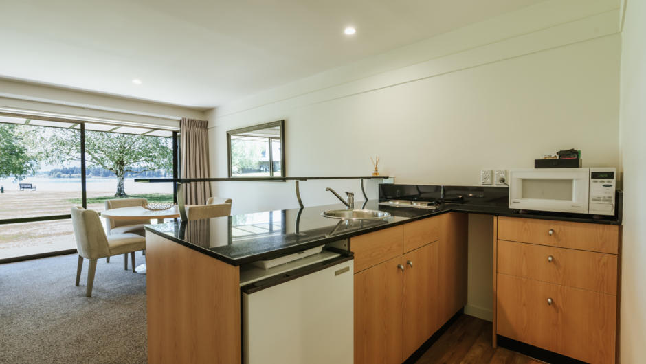 Kitchenette and dining of one bedroom suite and two bedroom apartment style accommodation