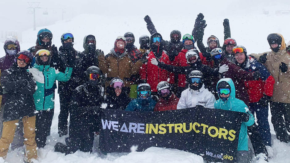 WE ARE SNO group photo on a powder day.