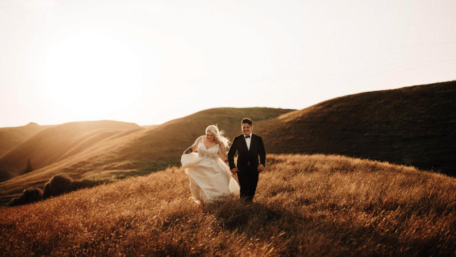 Wedding couple during sunset on the Hills of Drury, Auckland.