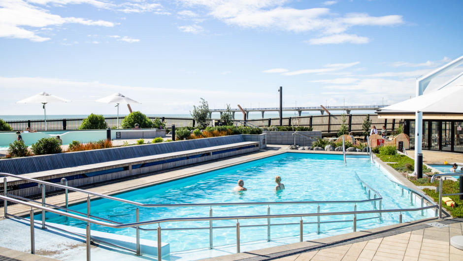 Relax after your bike ride to New Brighton in these hot pools while you lookover the beach. You may see the occasional surfer in the water.